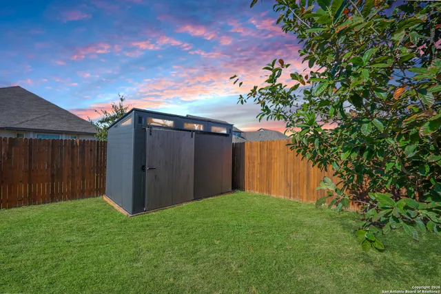 a backyard of a house with lots of green space