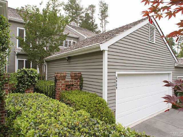 6909 Hunters Way Raleigh, NC 27615 - Photo 1 of 1 a view of a house with a yard