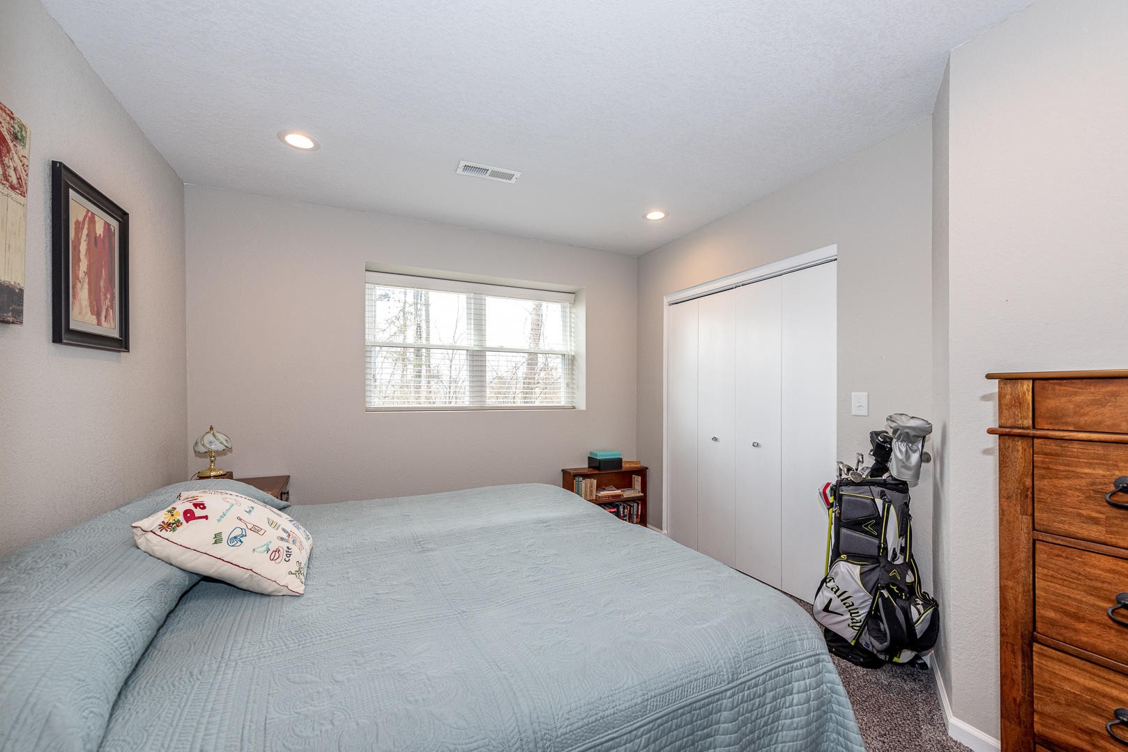 146 Cumberland View Drive Oak Ridge, TN 37830 - Photo 27 of 35 a bedroom with a bed and a chandelier