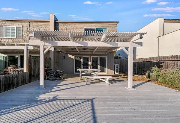a view of a patio with table and chairs floor to ceiling window with wooden floor
