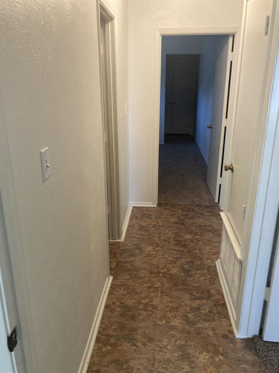 1202 Randy Drive Graham, TX 76450 - Photo 15 of 32 Hallway to primary bedroom.