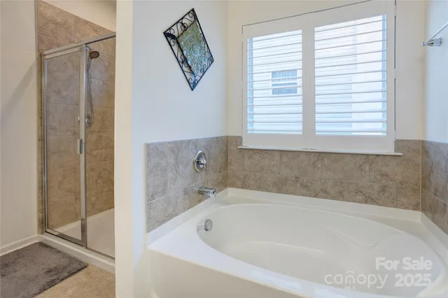a white bath tub sitting next to a window