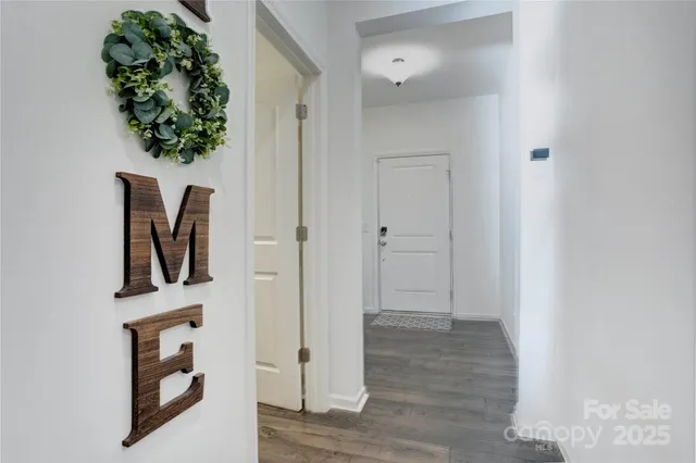 view of hallway with wooden floor