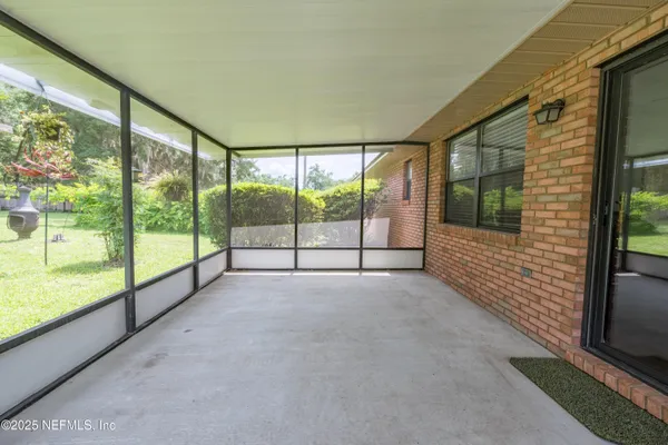 an aerial view of residential houses with outdoor space and street view