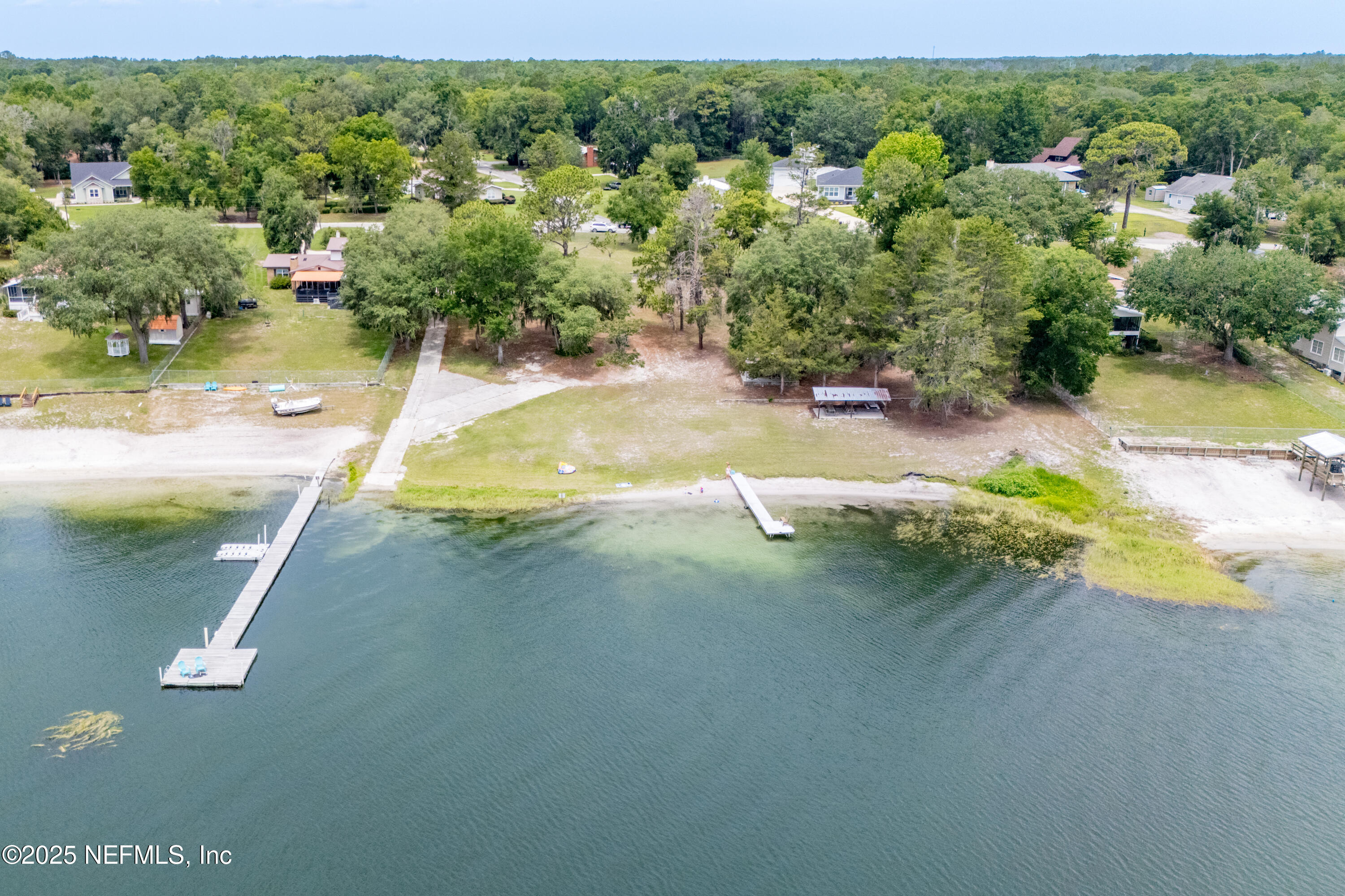363 Southeast 73rd Street Starke, FL 32091 - Photo 2 of 49 a view of a wooden house with a yard