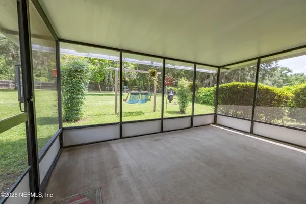 an aerial view of a house with pool yard seating and yard