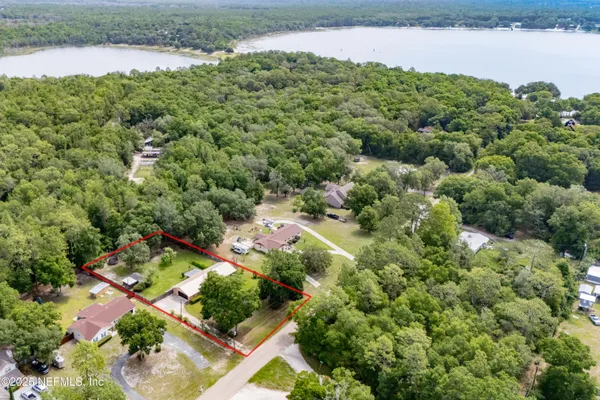 a kitchen with stainless steel appliances a sink stove and cabinets