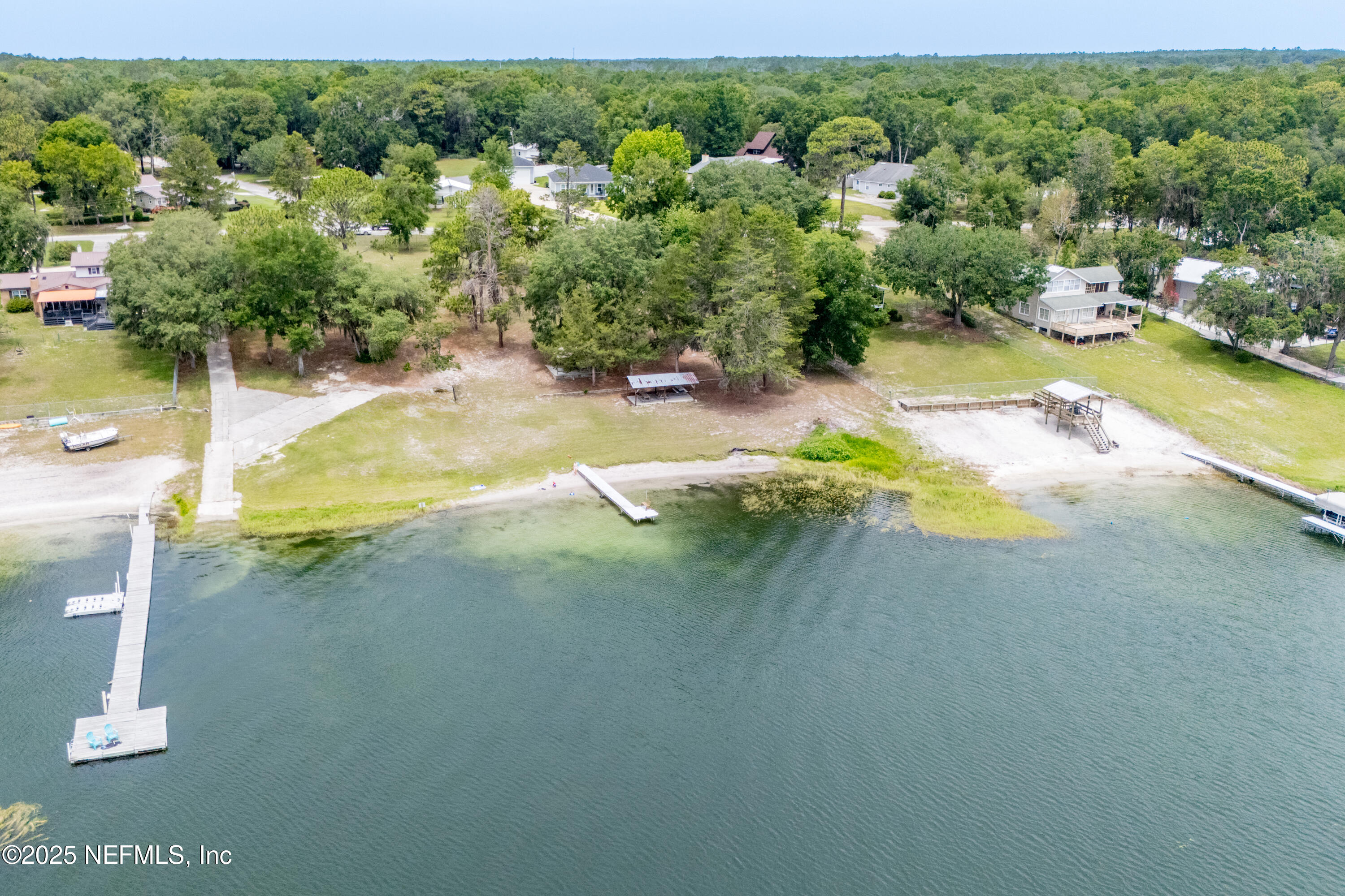 363 Southeast 73rd Street Starke, FL 32091 - Photo 4 of 49 an aerial view of residential houses with outdoor space and swimming pool