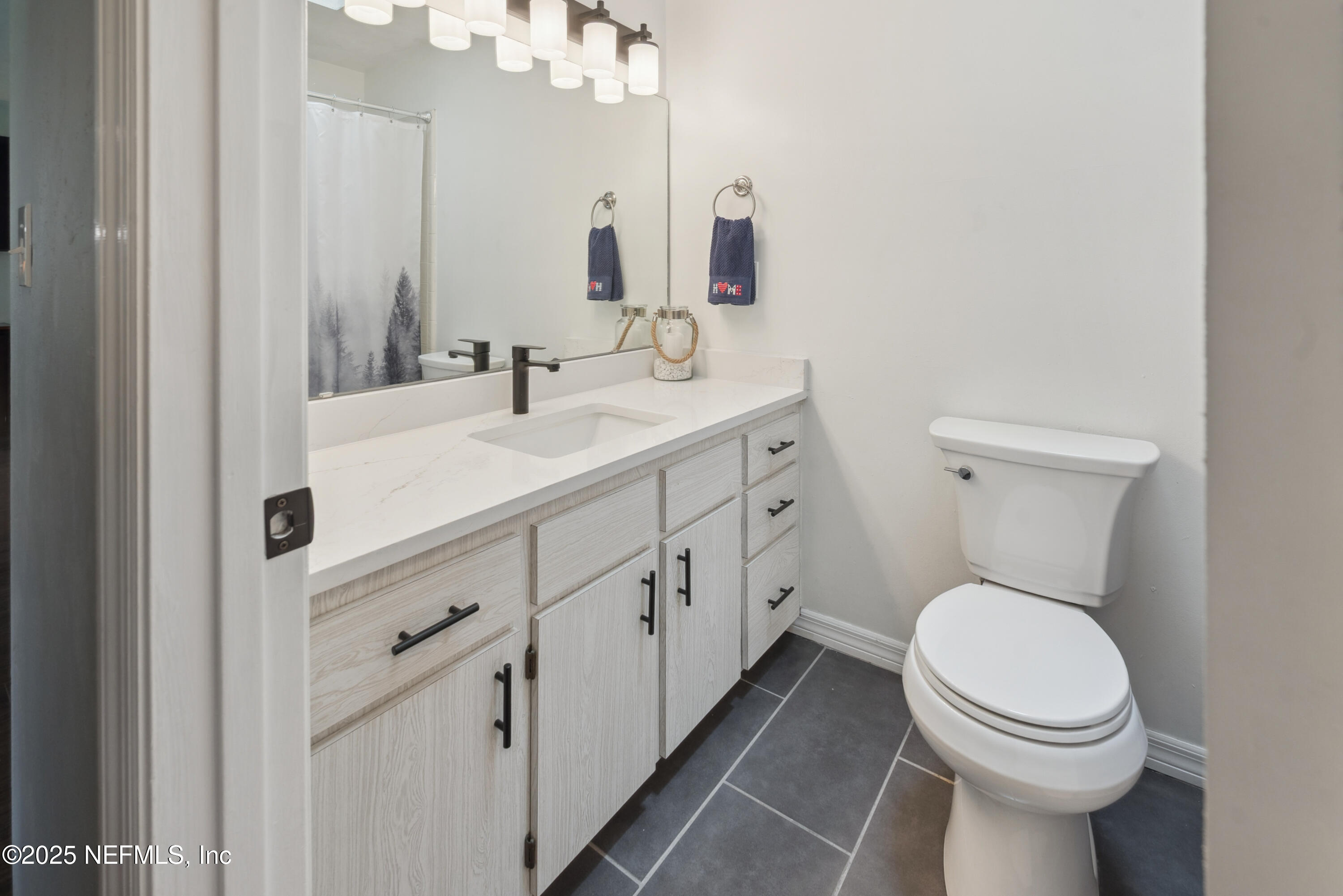 363 Southeast 73rd Street Starke, FL 32091 - Photo 42 of 49 a bathroom with a toilet sink and mirror