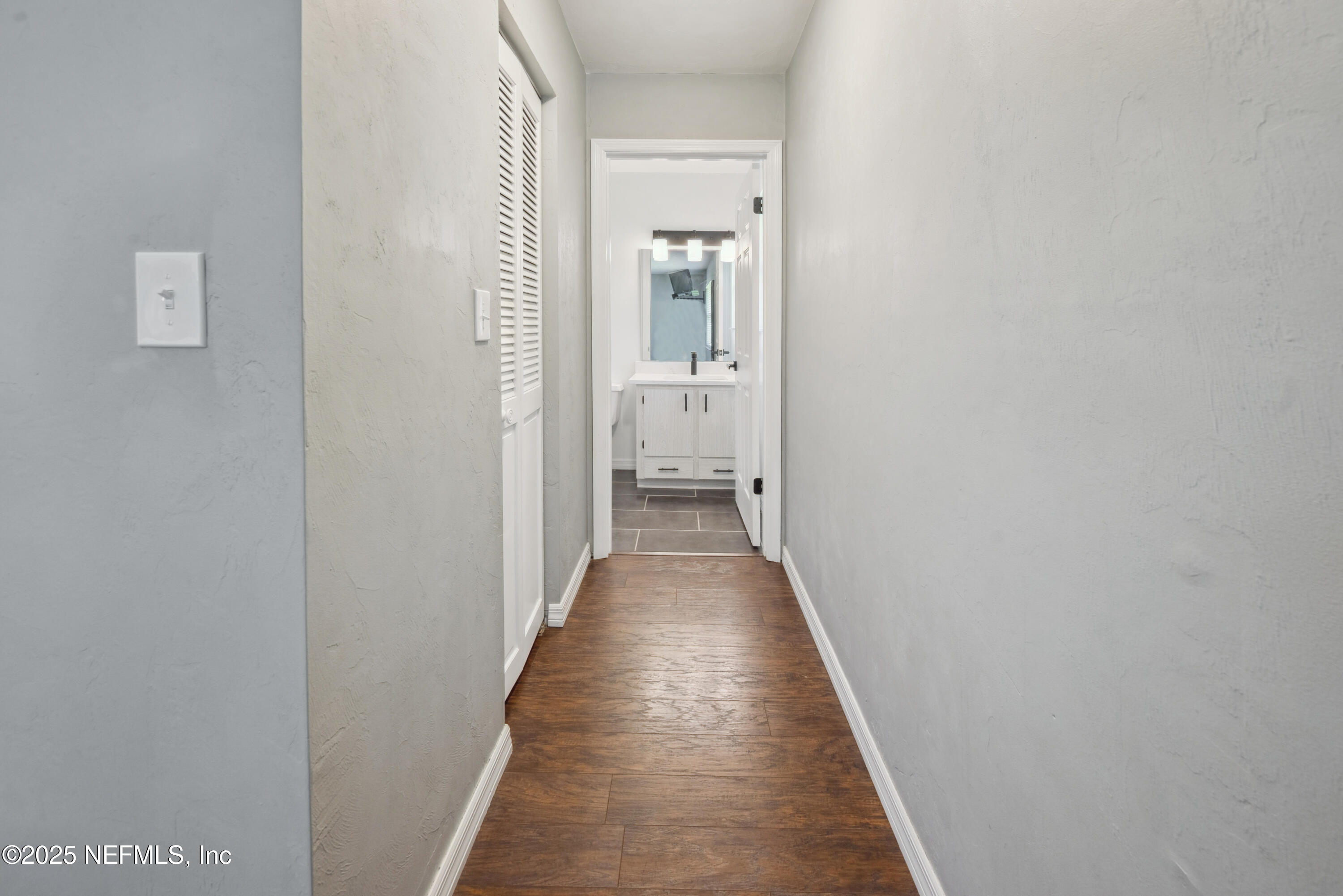 363 Southeast 73rd Street Starke, FL 32091 - Photo 44 of 49 a view of a hallway with wooden floor