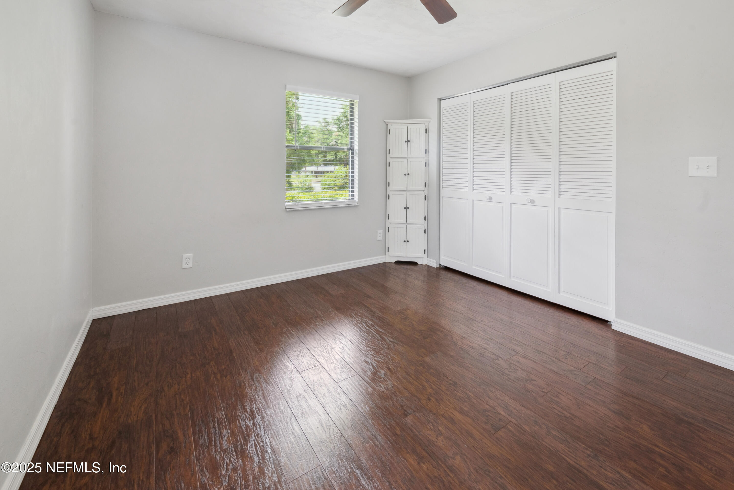 363 Southeast 73rd Street Starke, FL 32091 - Photo 45 of 49 an empty room with wooden floor and windows