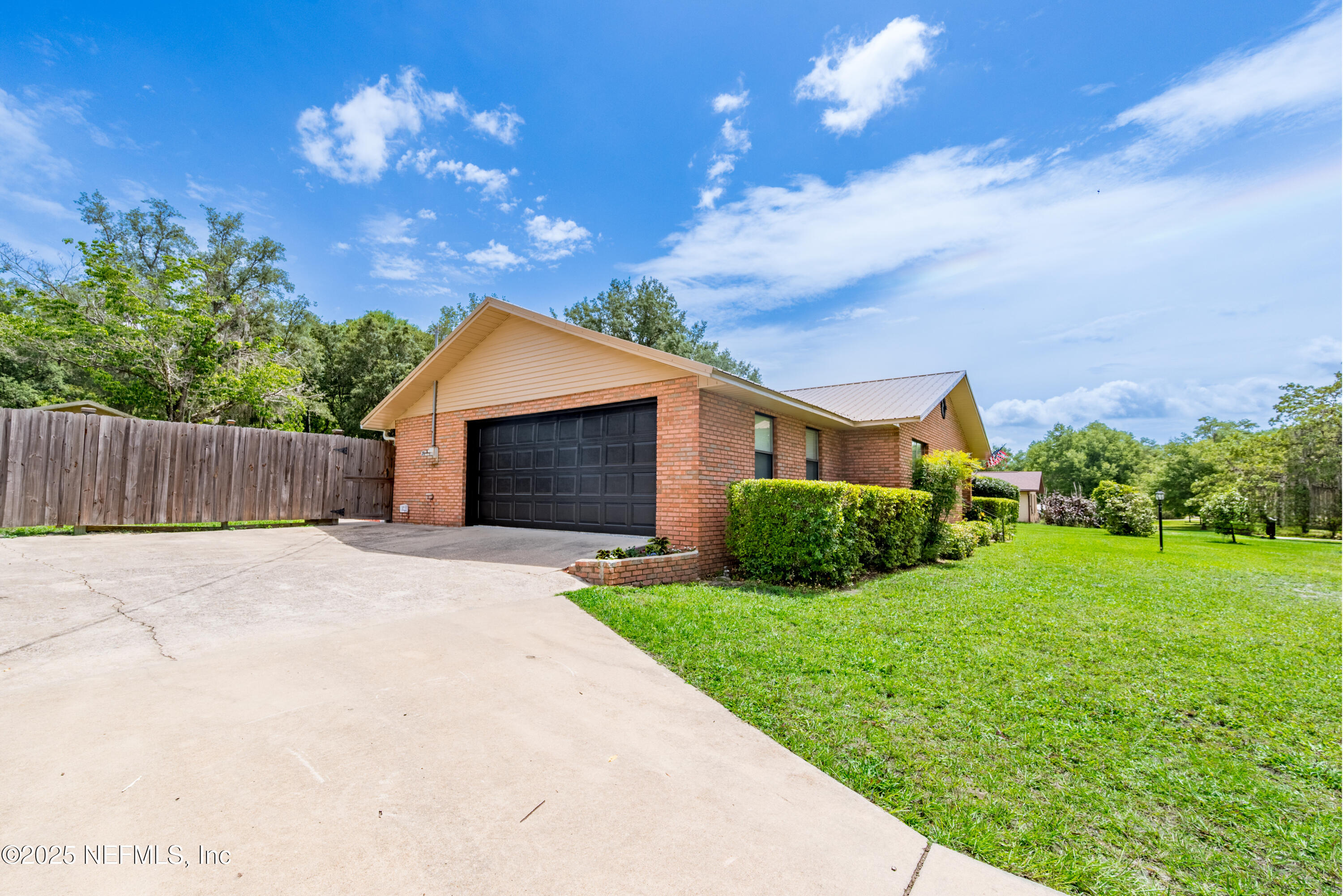 363 Southeast 73rd Street Starke, FL 32091 - Photo 7 of 49 a front view of a house with garden