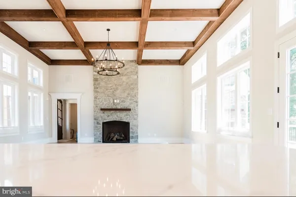 a kitchen with kitchen island a sink stove and cabinets