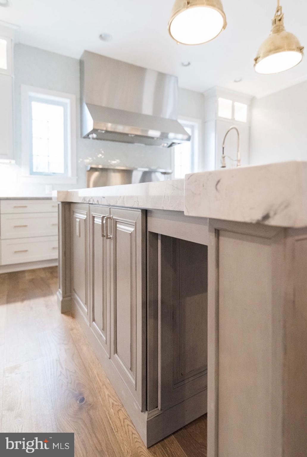 2517 Port Lane Fallston, MD 21047 - Photo 5 of 10 a kitchen with kitchen island a sink stove and cabinets