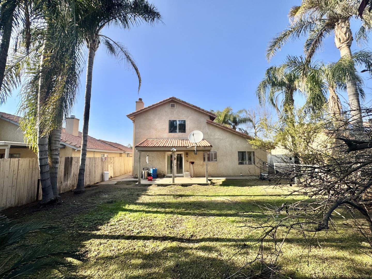 7605 Golden Rise Court Bakersfield, CA 93313 - Photo 15 of 16 a front view of a house with a yard table and chairs