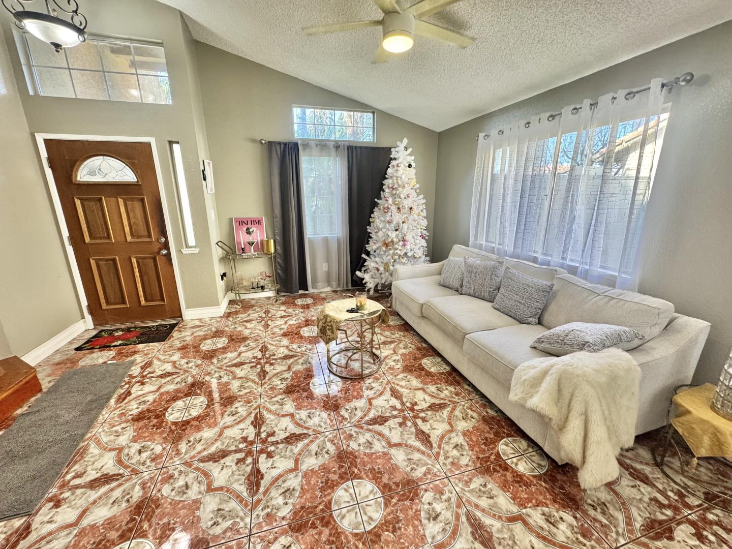 7605 Golden Rise Court Bakersfield, CA 93313 - Photo 4 of 16 a living room with a couch and a dresser