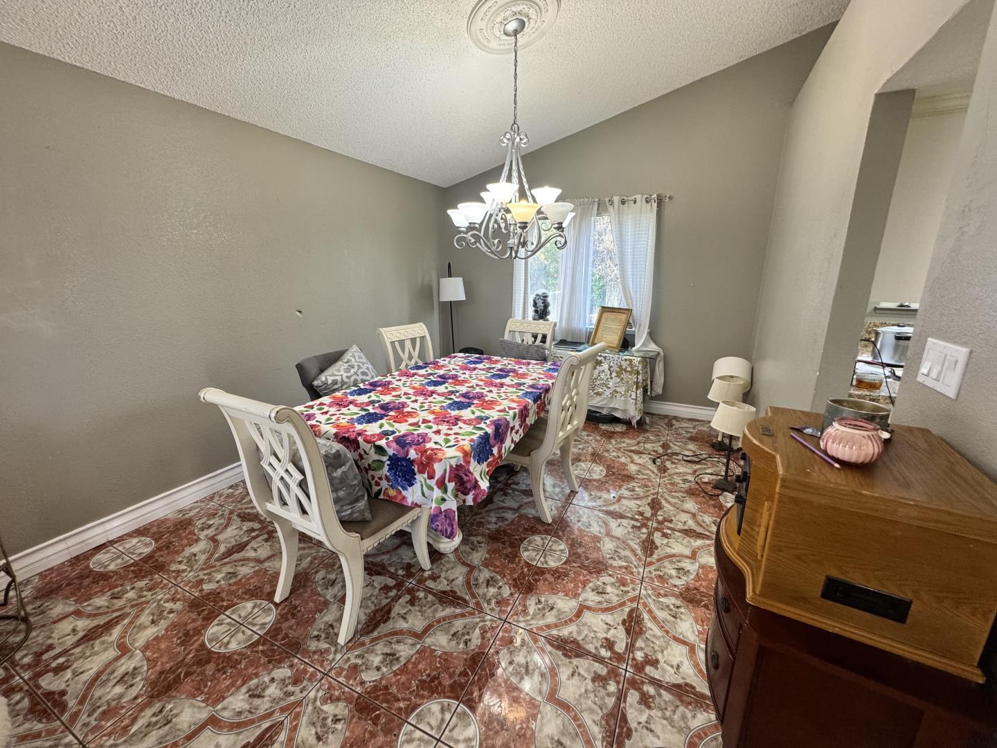 7605 Golden Rise Court Bakersfield, CA 93313 - Photo 5 of 16 a dining room with furniture and chandelier
