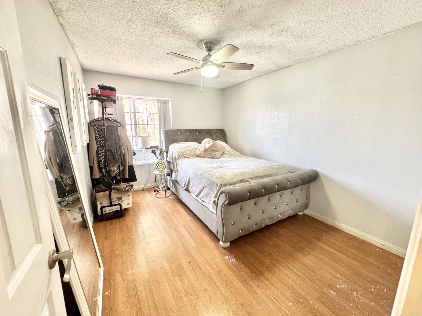 7605 Golden Rise Court Bakersfield, CA 93313 - Photo 9 of 16 a bedroom with a bed and a flat screen tv