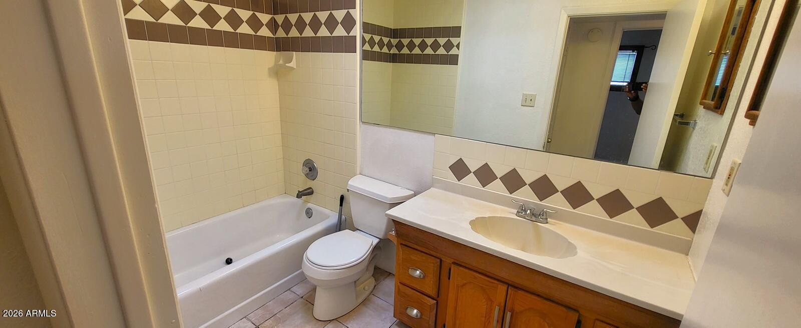 1125 South Stratton Lane Tempe, AZ 85281 - Photo 9 of 10 a bathroom with a sink toilet and shower