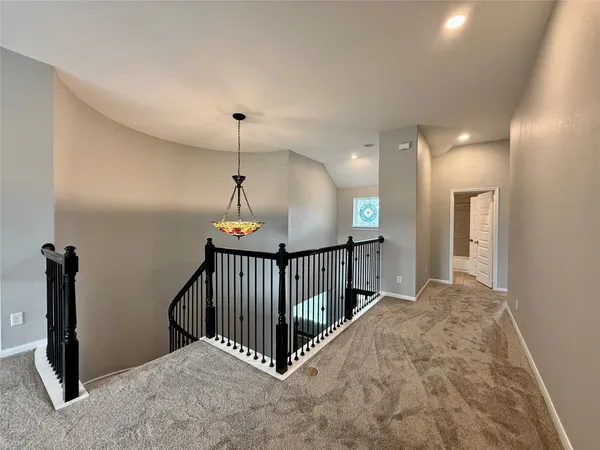a view of a hallway with a livingroom