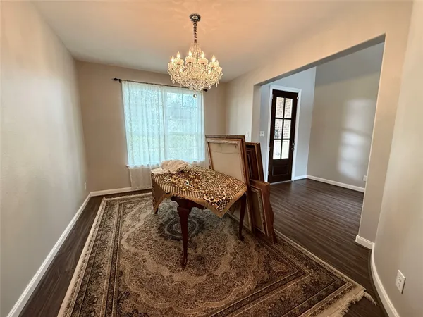 a view of a room with furniture window and wooden floor