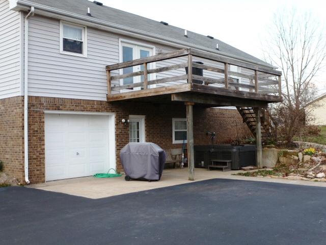 2116 Lock B Road North Clarksville, TN 37043 - Photo 17 of 20 Rear view of home showing the one car basement garage, Deck, and large parking/turn around area
