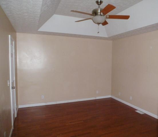 2116 Lock B Road North Clarksville, TN 37043 - Photo 7 of 20 Roomy Master Bedroom (15x12)with Tray Ceiling,Ceiling Fan,Walk in Closet,Full Bath,and Hardwood Flooring