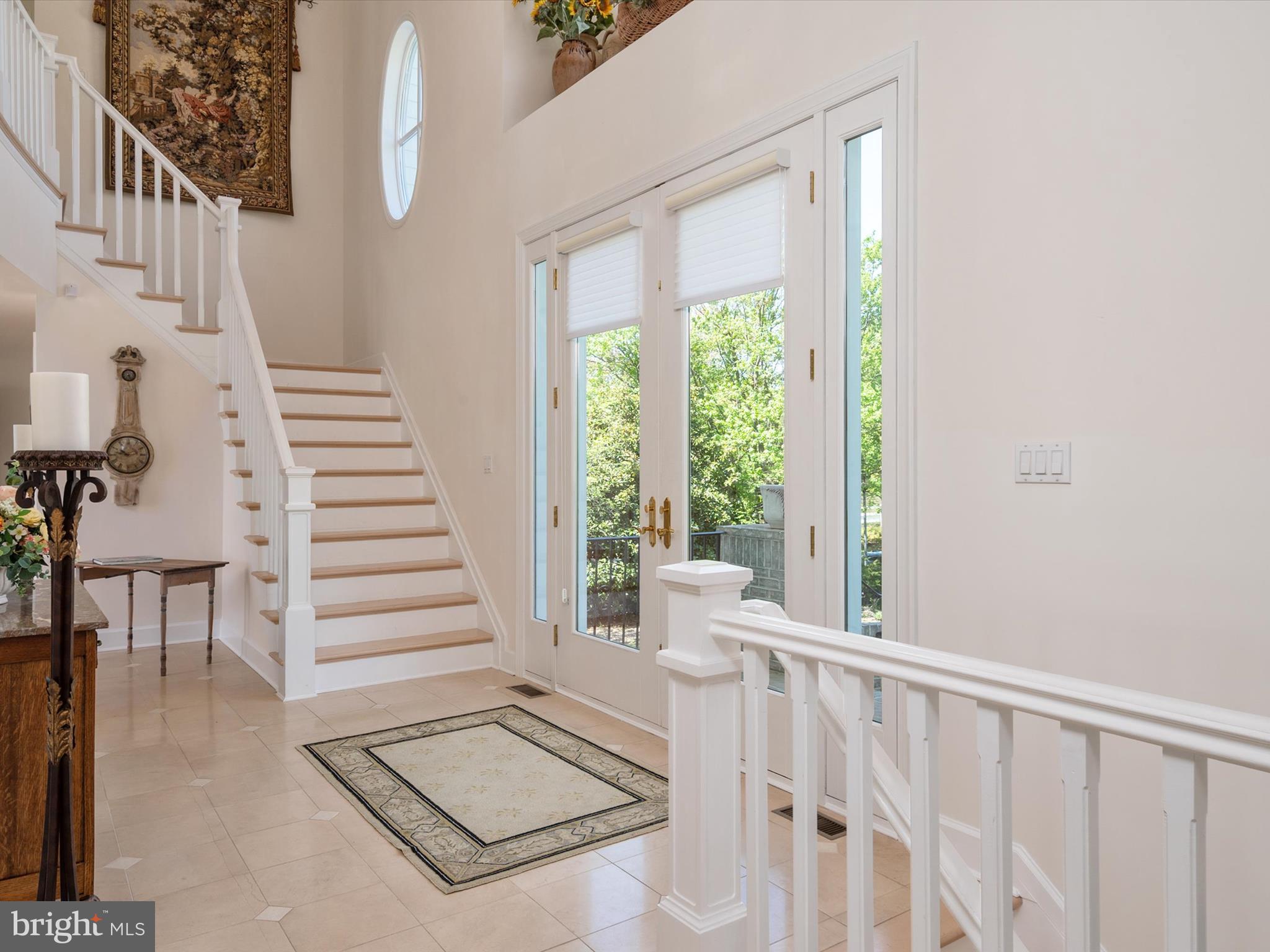 1237 Cherry Tree Lane Annapolis, MD 21403 - Photo 15 of 86 a view of staircase with white walls and windows