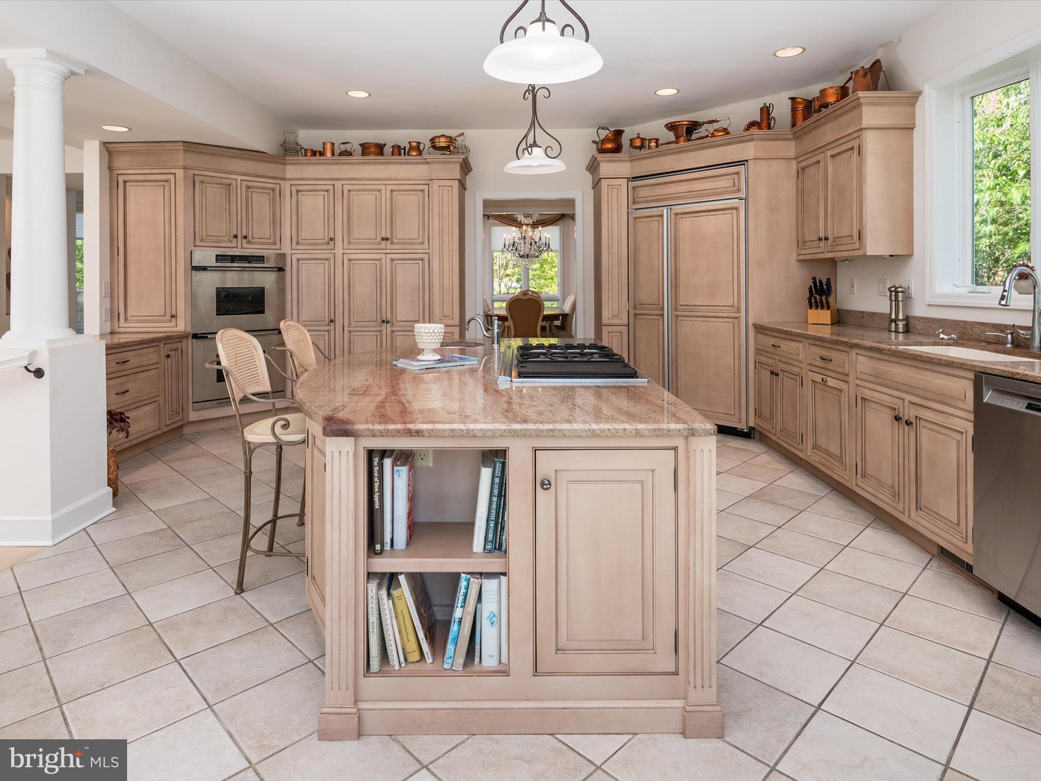 1237 Cherry Tree Lane Annapolis, MD 21403 - Photo 21 of 86 a kitchen with kitchen island granite countertop a stove a sink and a refrigerator