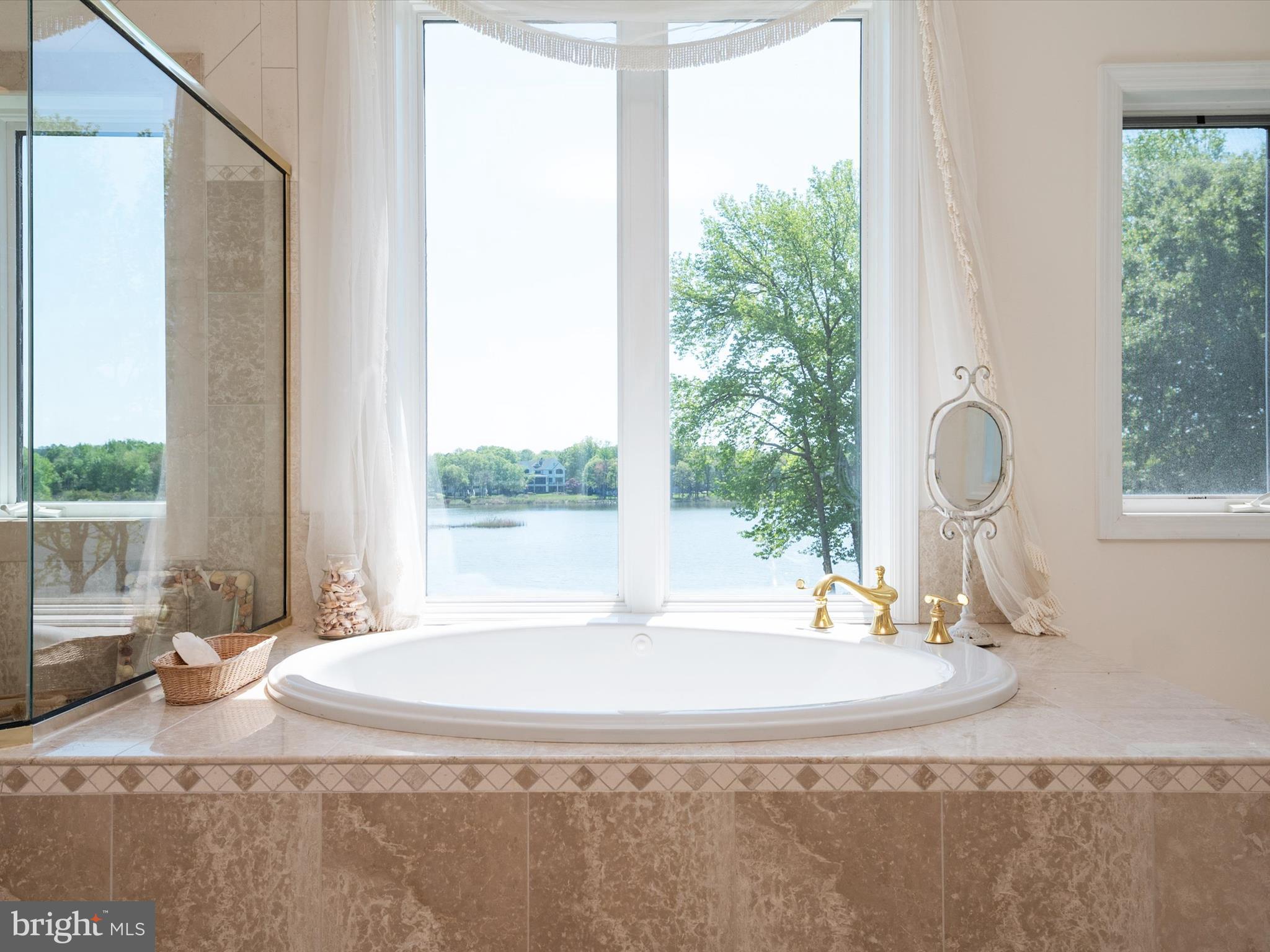 1237 Cherry Tree Lane Annapolis, MD 21403 - Photo 40 of 86 a bathroom with a granite countertop sink and a window