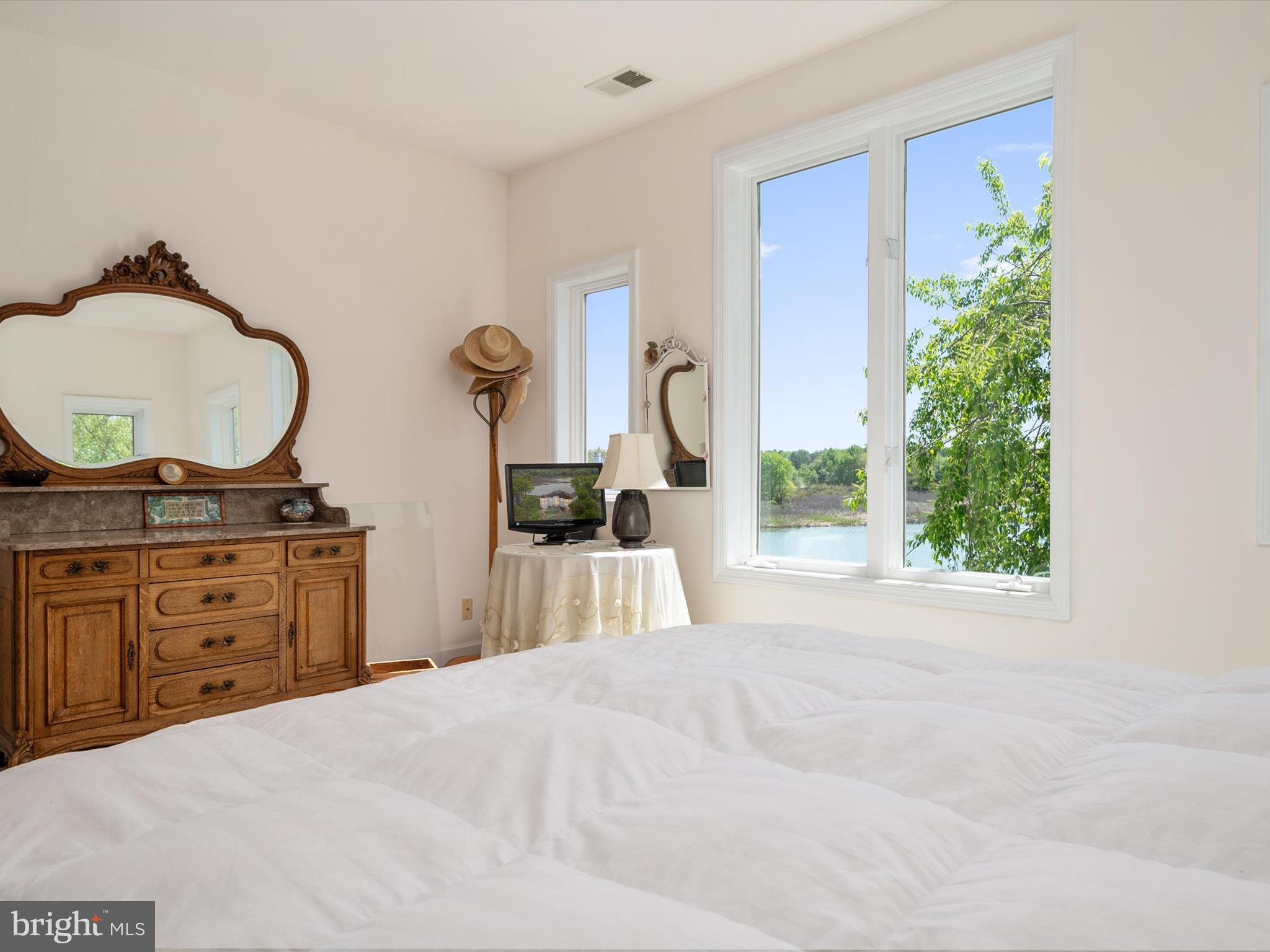 1237 Cherry Tree Lane Annapolis, MD 21403 - Photo 46 of 86 a bedroom with a bed and a dresser