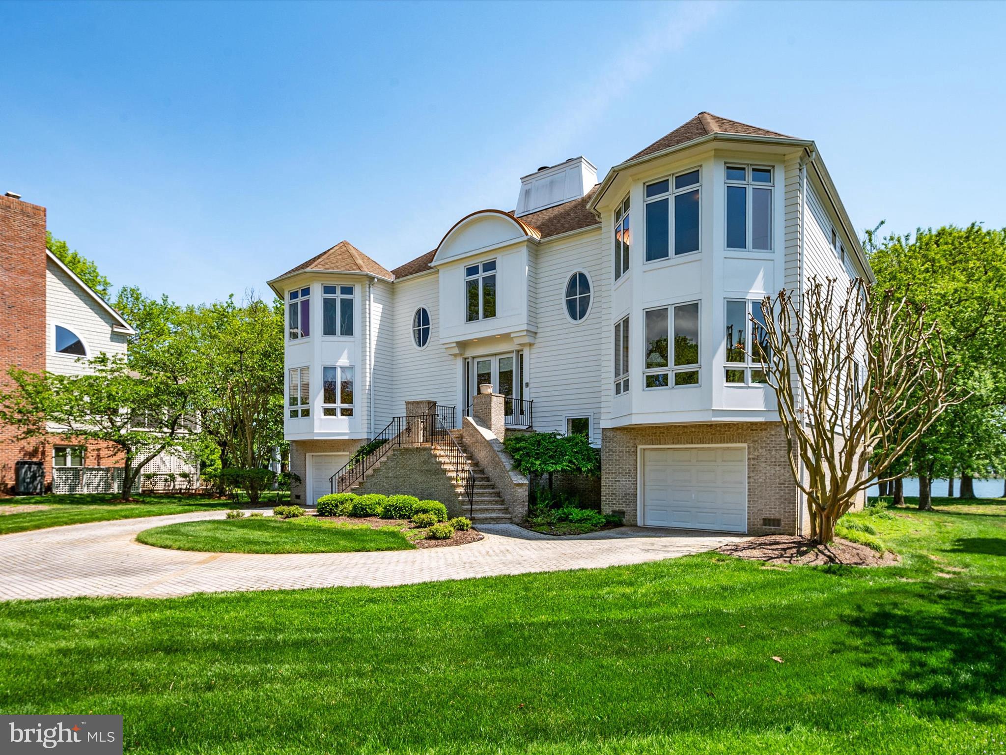 1237 Cherry Tree Lane Annapolis, MD 21403 - Photo 10 of 86 a front view of a house with a yard and garage