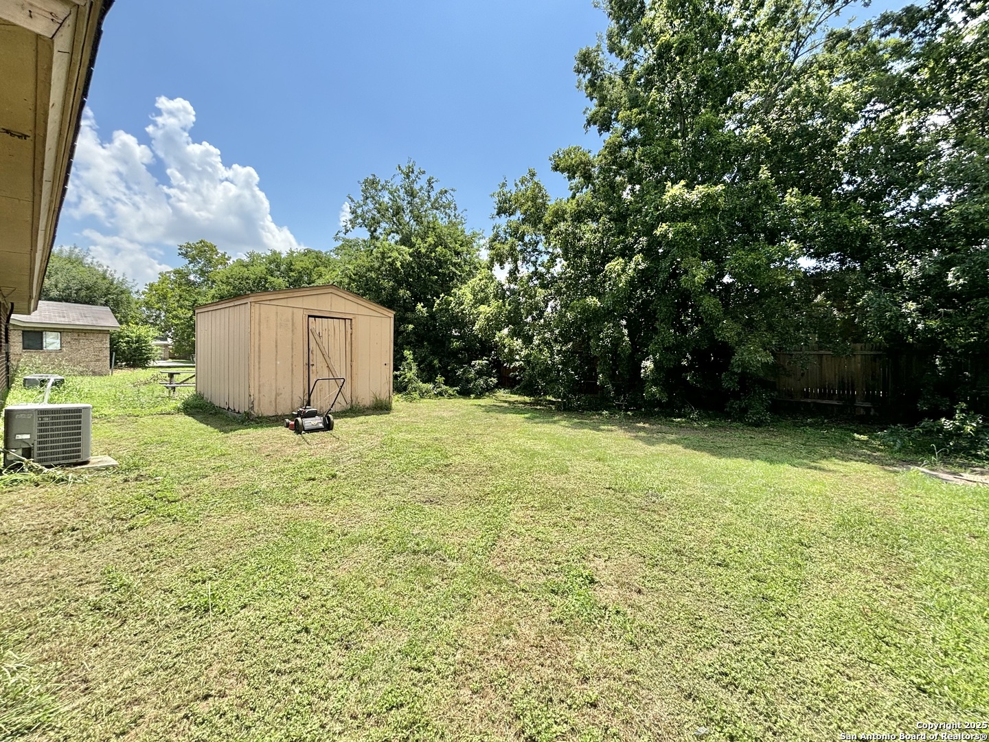 207 Redbud Lane, Unit B New Braunfels, TX 78130 - Photo 11 of 11 a backyard of a house with lots of green space