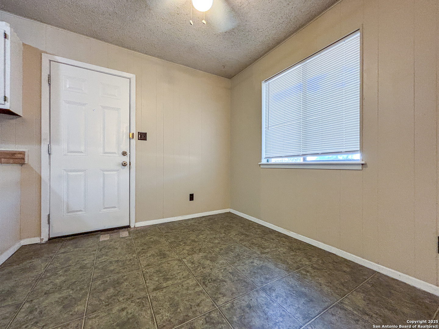 207 Redbud Lane, Unit B New Braunfels, TX 78130 - Photo 5 of 11 an empty room with windows
