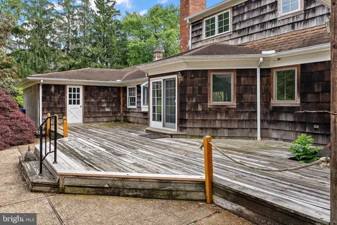 a view of house with outdoor seating