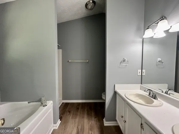 a bathroom with a sink and a large mirror