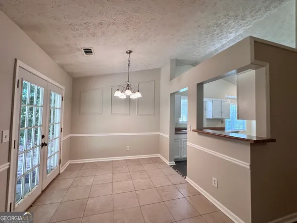 a bathroom with a sink a large mirror and a bathtub