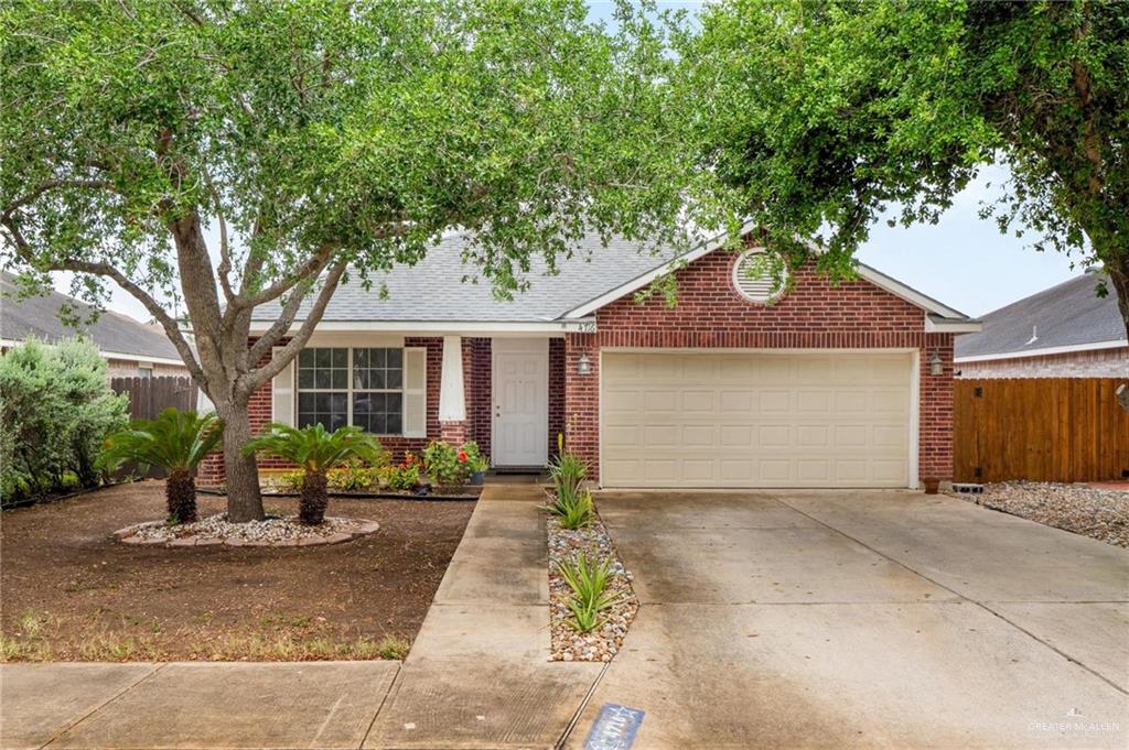 4716 Xanthisma Avenue McAllen, TX 78504 - Photo 1 of 17 a front view of a house with garden