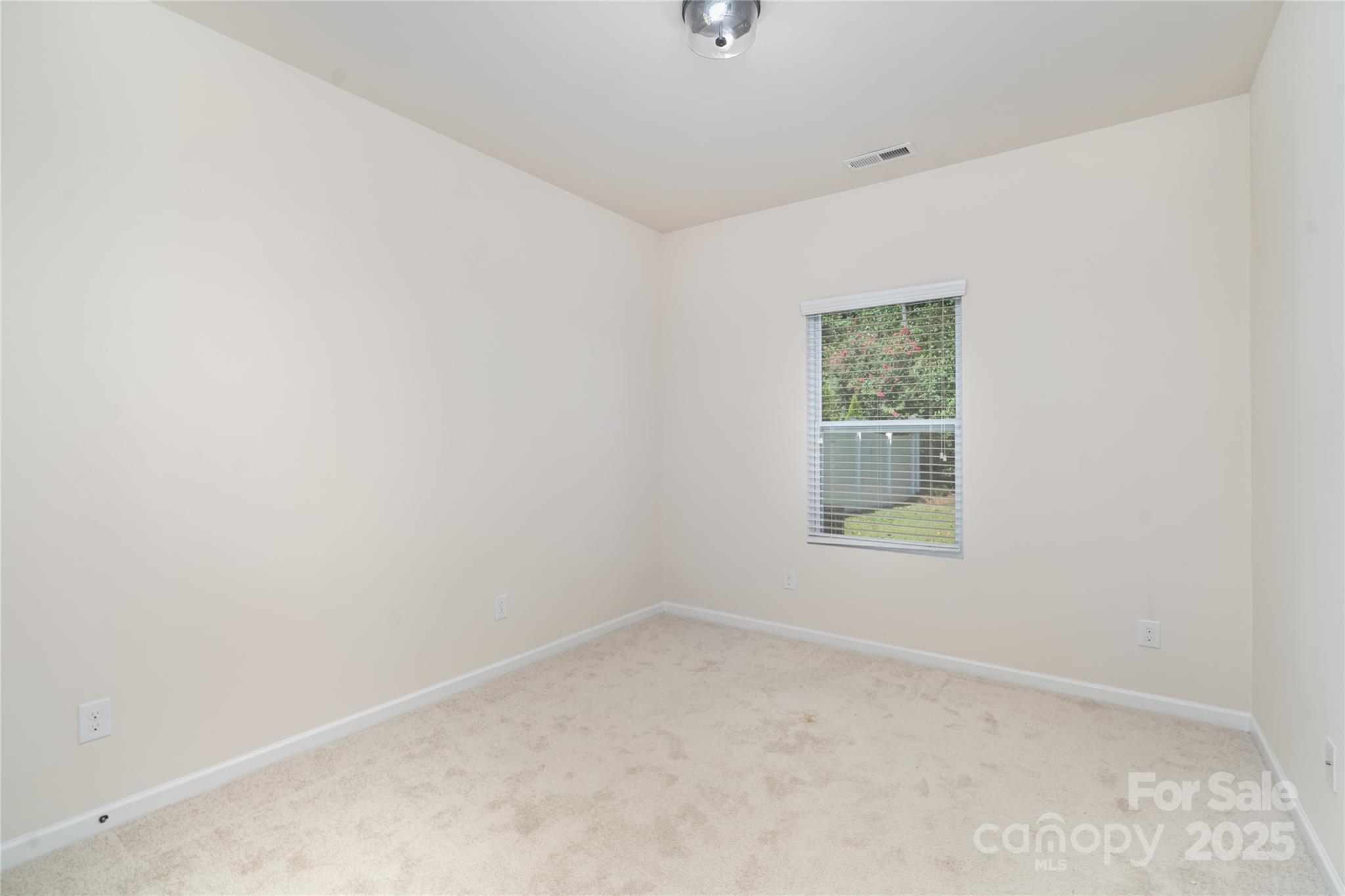 1528 Spring Blossom Trail Fort Mill, SC 29708 - Photo 11 of 26 an empty room with a window