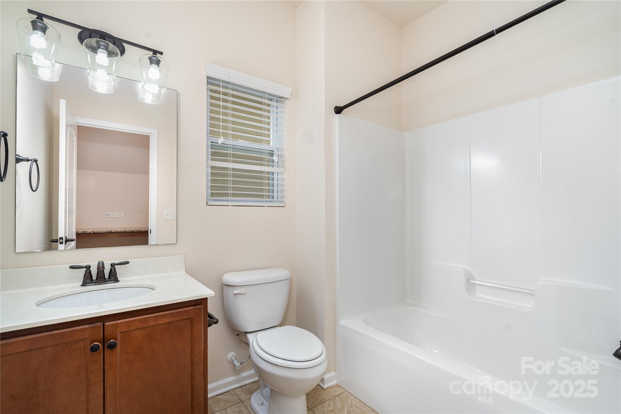 1528 Spring Blossom Trail Fort Mill, SC 29708 - Photo 12 of 26 a bathroom with a sink toilet and shower