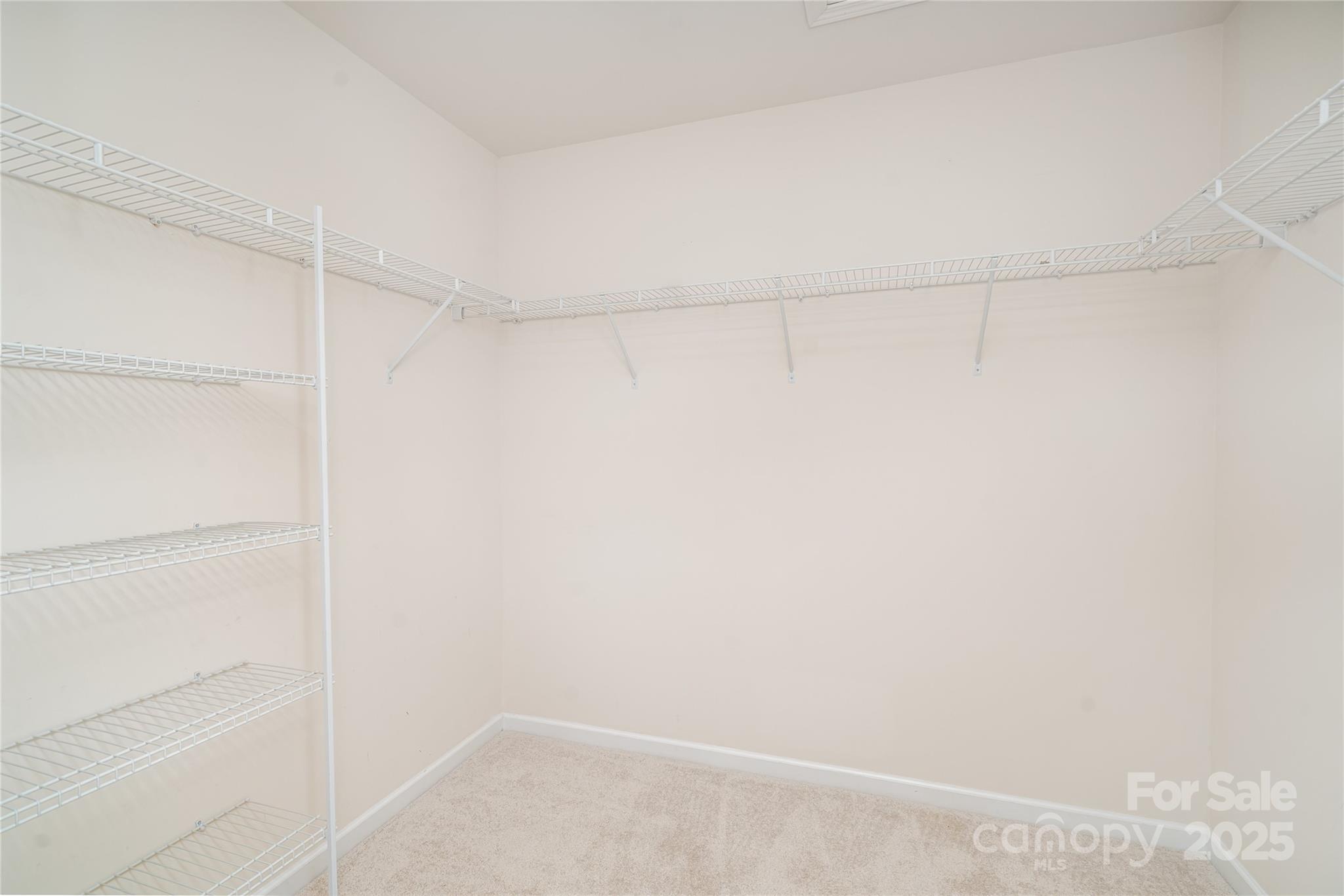 1528 Spring Blossom Trail Fort Mill, SC 29708 - Photo 16 of 26 a view of a room with racks on the wall