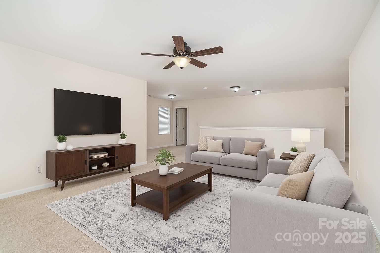 1528 Spring Blossom Trail Fort Mill, SC 29708 - Photo 17 of 26 a living room with furniture and a flat screen tv