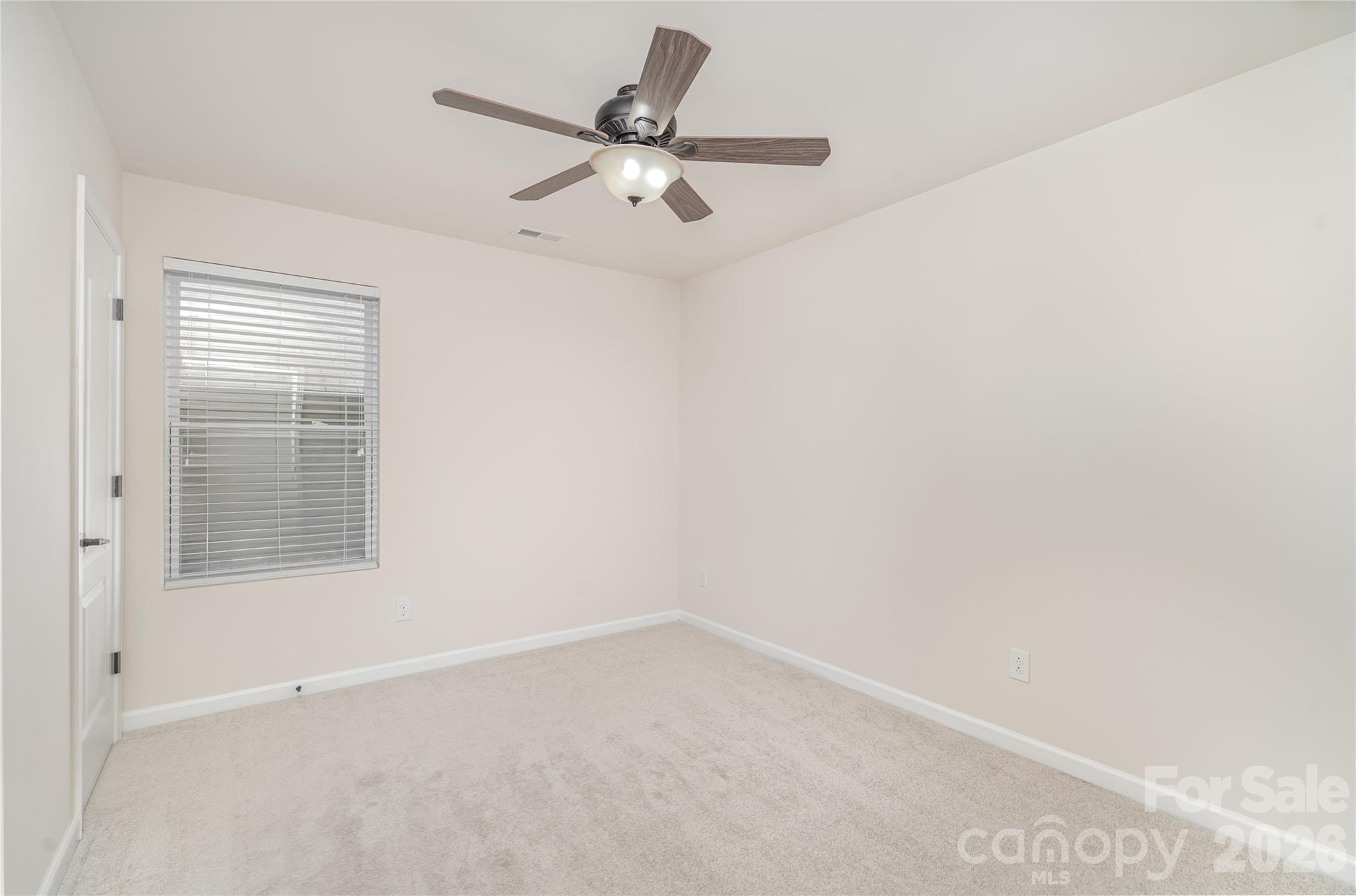 1528 Spring Blossom Trail Fort Mill, SC 29708 - Photo 22 of 31 an empty room with a window
