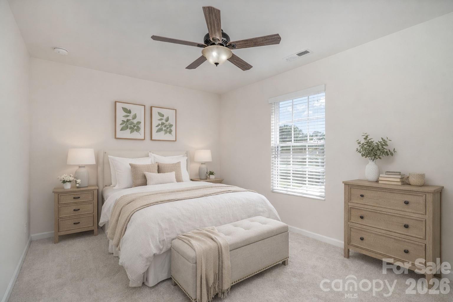 1528 Spring Blossom Trail Fort Mill, SC 29708 - Photo 26 of 31 a bedroom with a bed and a window