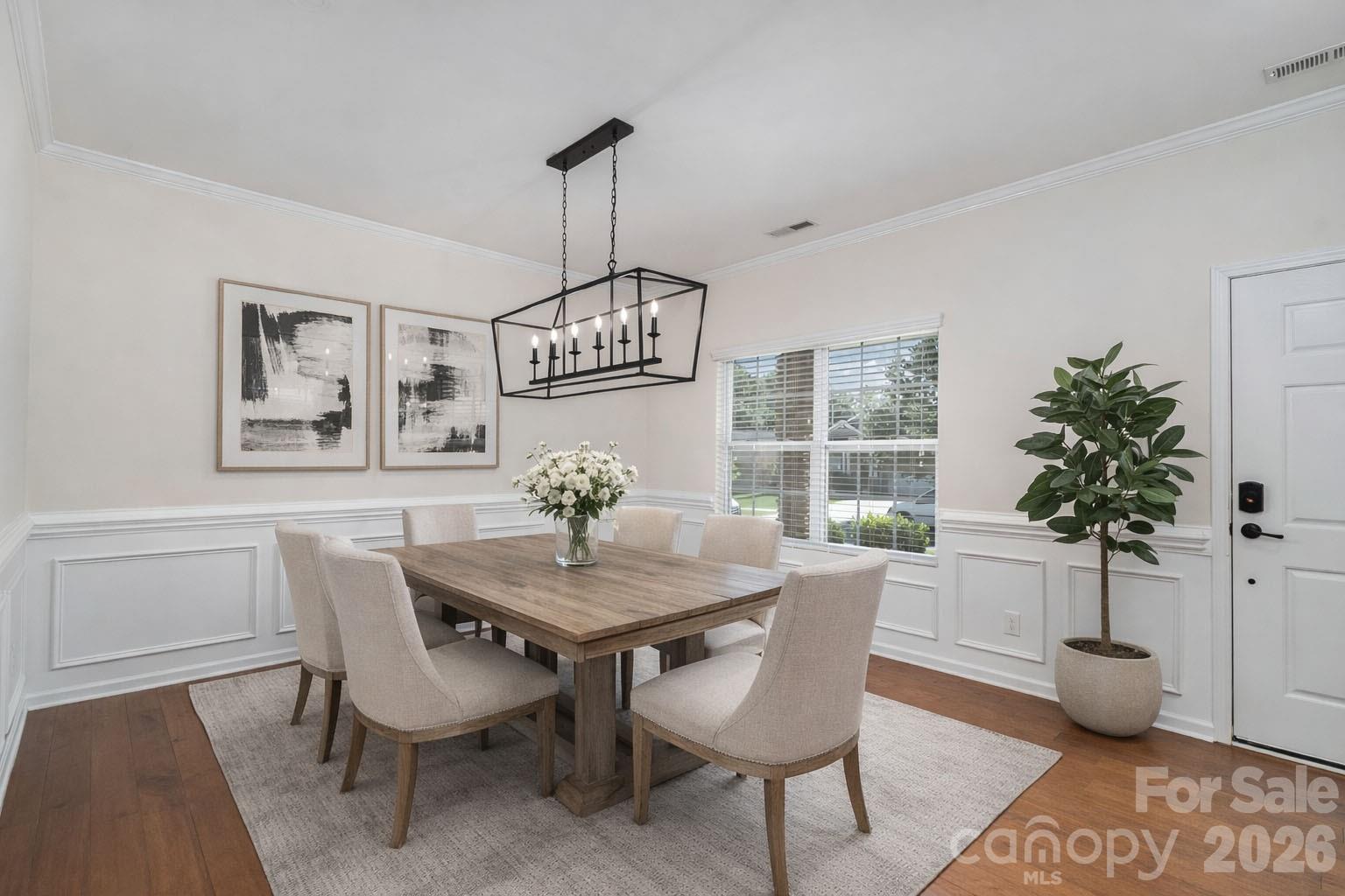1528 Spring Blossom Trail Fort Mill, SC 29708 - Photo 5 of 31 a view of a dining room with furniture window and wooden floor