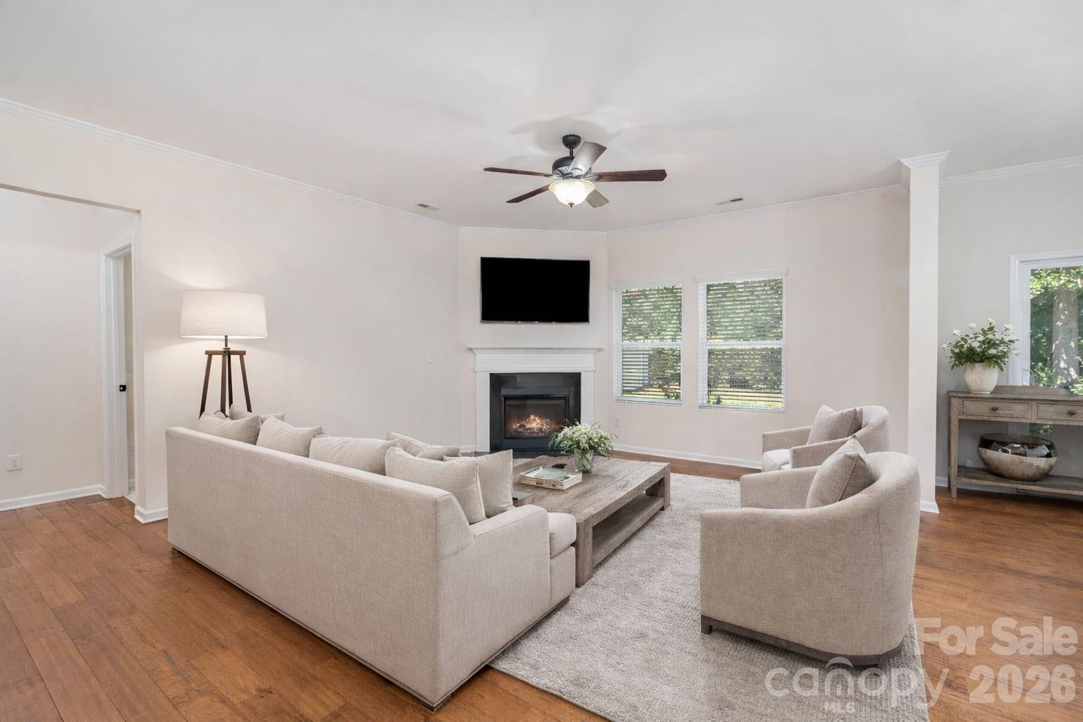 1528 Spring Blossom Trail Fort Mill, SC 29708 - Photo 7 of 31 a living room with furniture fireplace and a flat screen tv