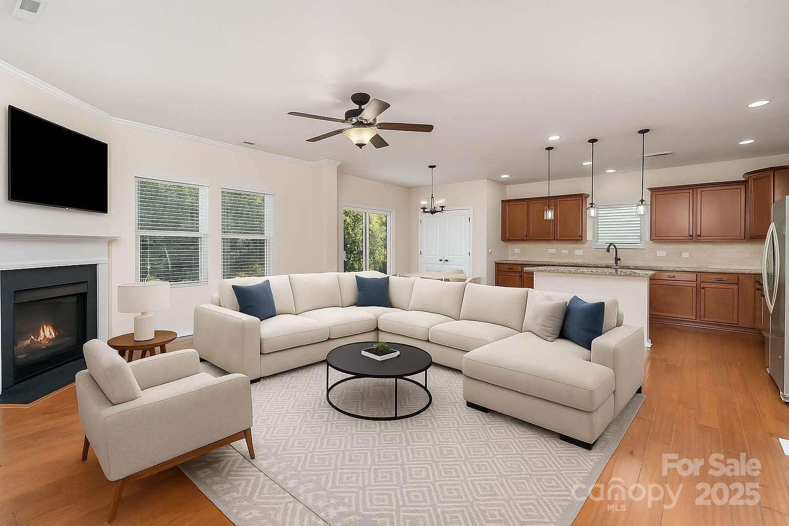 1528 Spring Blossom Trail Fort Mill, SC 29708 - Photo 7 of 26 a living room with furniture a fireplace and a flat screen tv