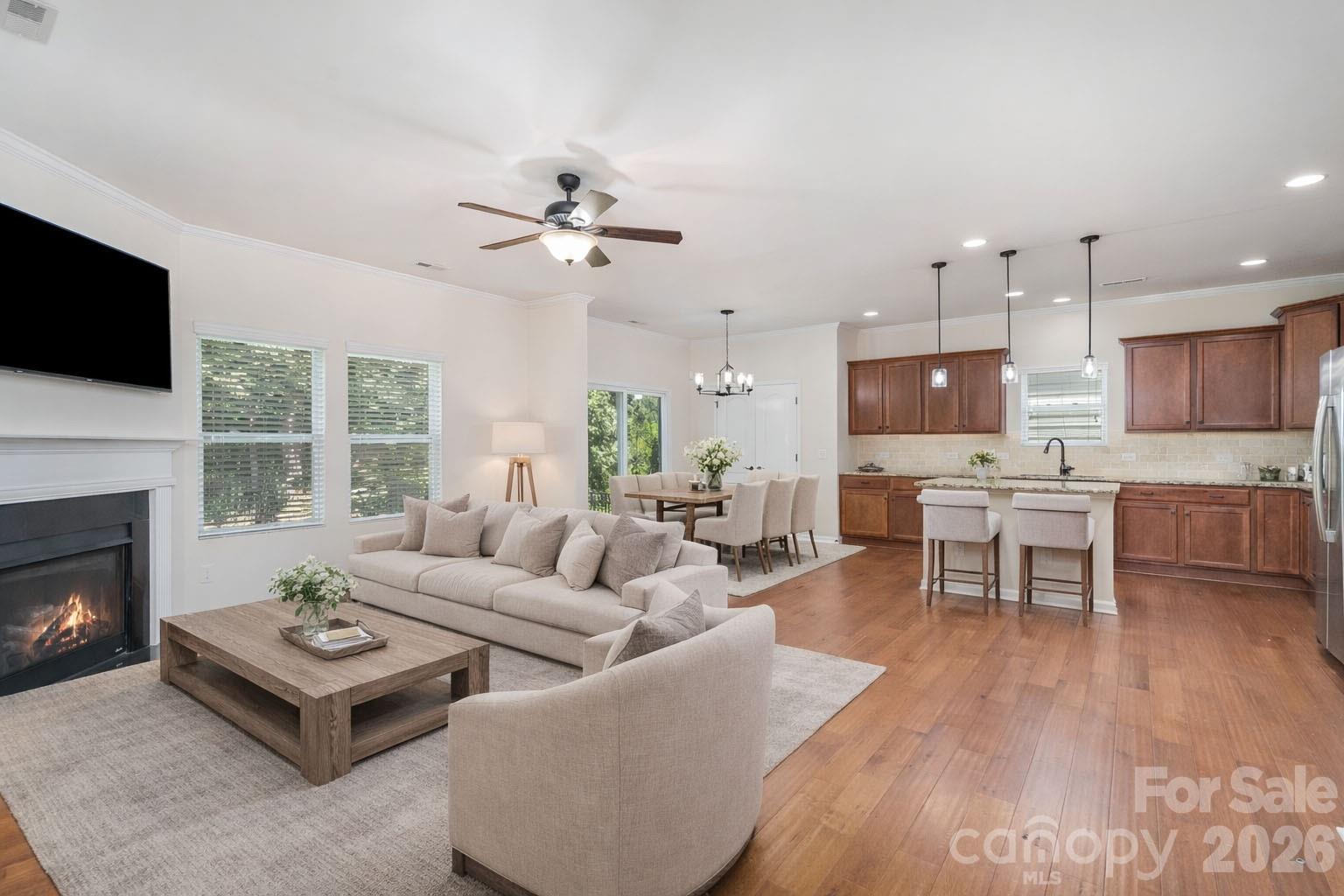 1528 Spring Blossom Trail Fort Mill, SC 29708 - Photo 8 of 31 a living room with furniture fireplace and a flat screen tv