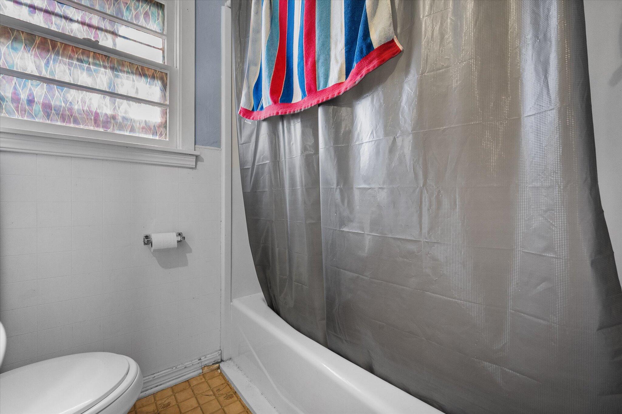 2013 58th Street Lubbock, TX 79412 - Photo 14 of 17 a bathroom with a sink and toilet
