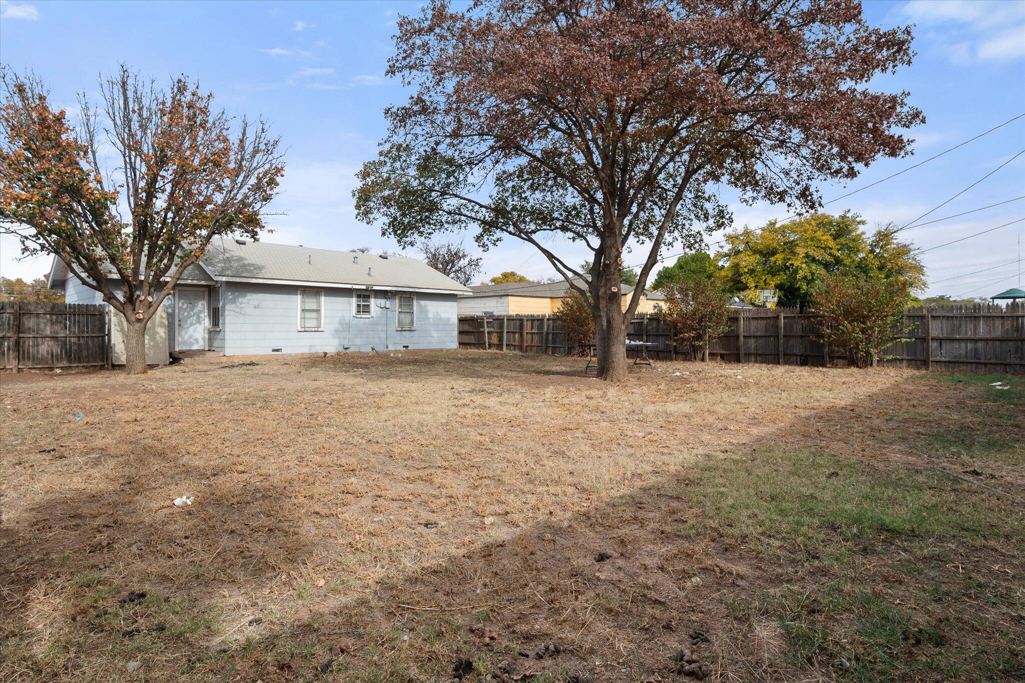 2013 58th Street Lubbock, TX 79412 - Photo 17 of 17 a view of house with a yard